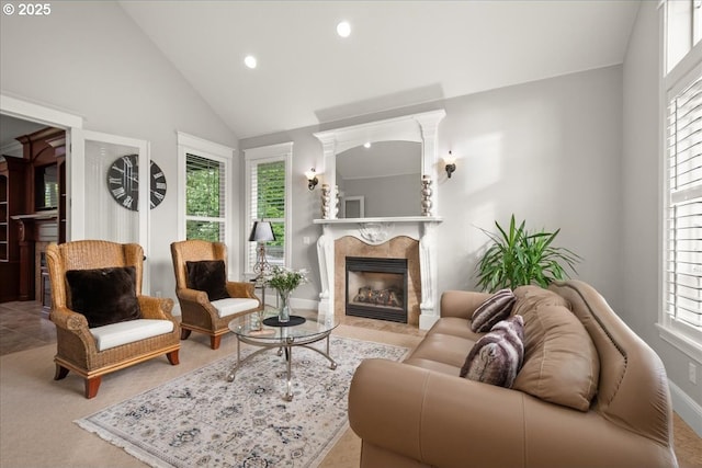 904 NE 224th Cir, Ridgefield, WA 98642 - carpeted living area featuring plenty of natural light, recessed lighting, a tiled fireplace, baseboards, and high vaulted ceiling
