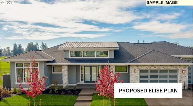 view of front of house featuring an attached garage, a front lawn, concrete driveway, and french doors