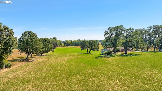 view of property's community featuring a yard