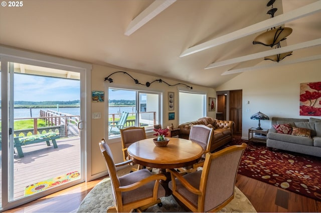 57569 Parkersburg Rd, Bandon, OR 97411 - dining room with wood finished floors and a water view