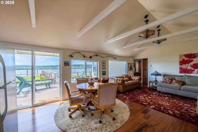 57569 Parkersburg Rd, Bandon, OR 97411 - dining area featuring beamed ceiling, wood finished floors, a water view, and high vaulted ceiling