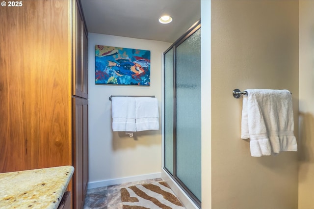 57569 Parkersburg Rd, Bandon, OR 97411 - bathroom with a stall shower, baseboards, and recessed lighting