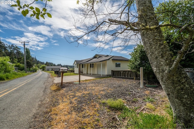 57569 Parkersburg Rd, Bandon, OR 97411 - view of home's exterior with driveway