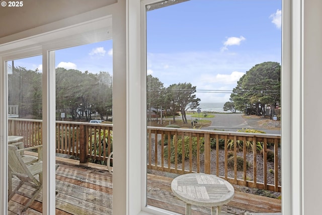 interior space featuring plenty of natural light and a water view