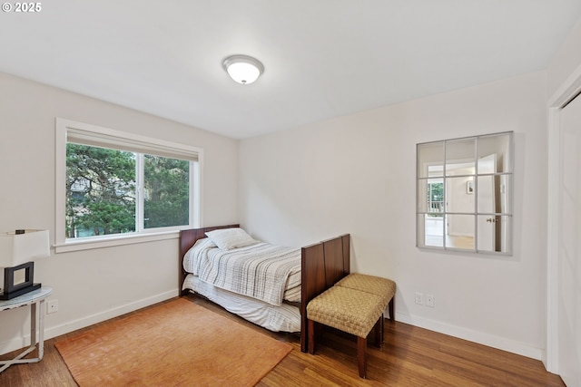 bedroom with hardwood / wood-style floors