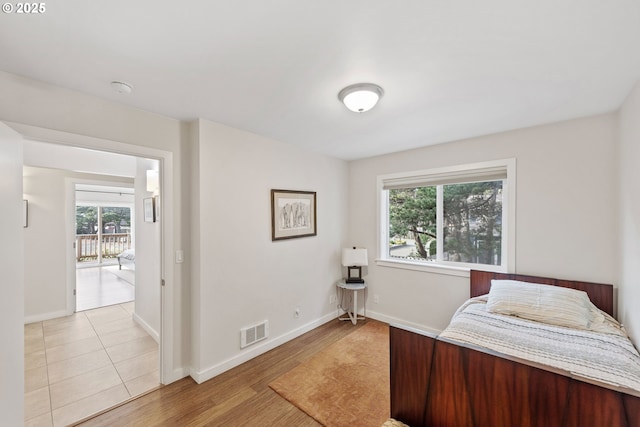 bedroom with light hardwood / wood-style flooring