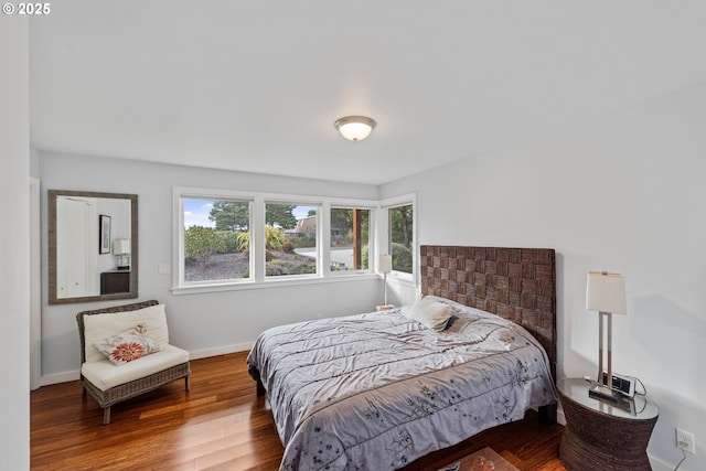 bedroom with hardwood / wood-style flooring