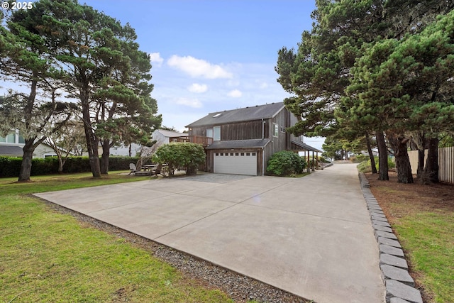 view of home's exterior featuring a yard and a garage