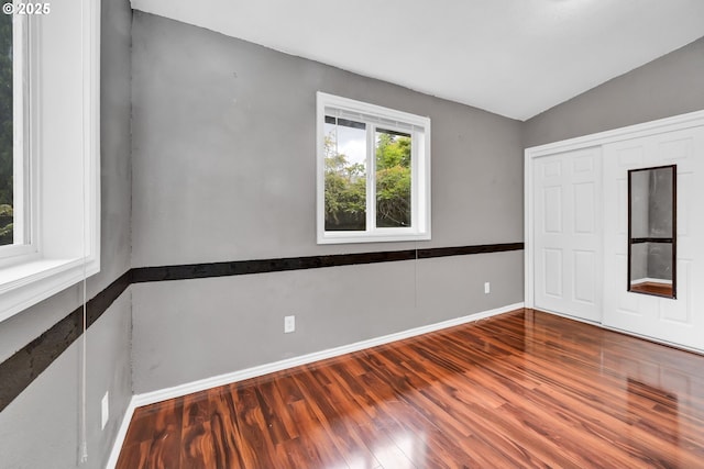 2280 Dakota St, Eugene, OR 97402 - unfurnished bedroom featuring wood finished floors, baseboards, vaulted ceiling, and a closet