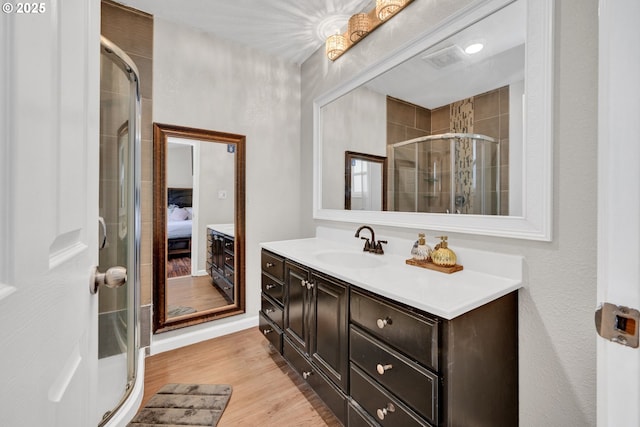 2280 Dakota St, Eugene, OR 97402 - ensuite bathroom with a stall shower, vanity, and wood finished floors