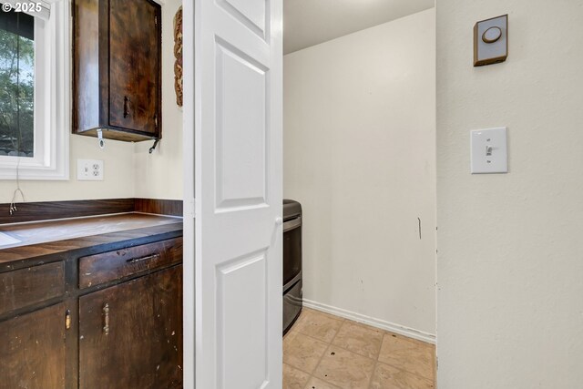 2280 Dakota St, Eugene, OR 97402 - kitchen featuring dark brown cabinets, dark countertops, and baseboards