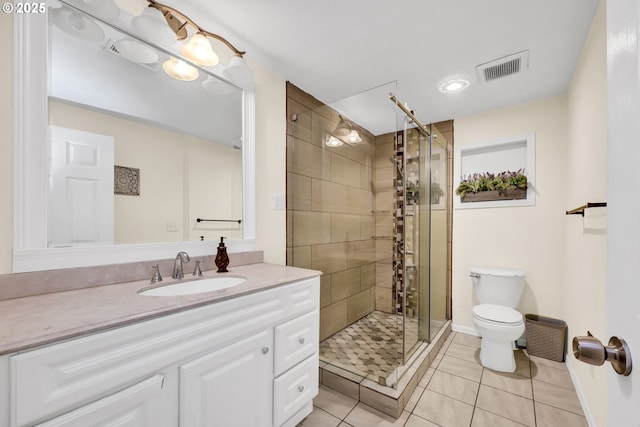 2280 Dakota St, Eugene, OR 97402 - bathroom featuring toilet, vanity, a stall shower, tile patterned floors, and baseboards