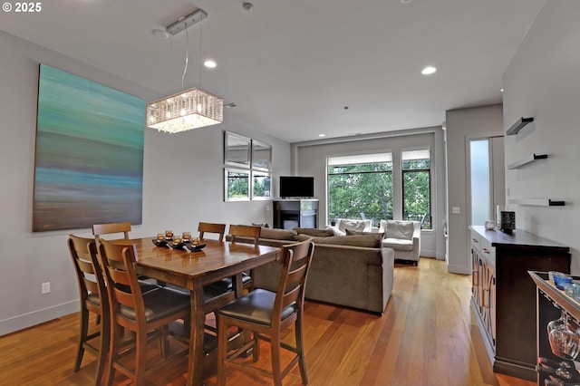 1746 NW Riverscape St, Portland, OR 97209 - dining space featuring a chandelier, light wood-style floors, baseboards, and recessed lighting
