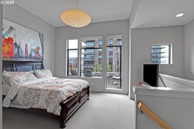 1746 NW Riverscape St, Portland, OR 97209 - bedroom featuring access to outside, multiple windows, and carpet floors