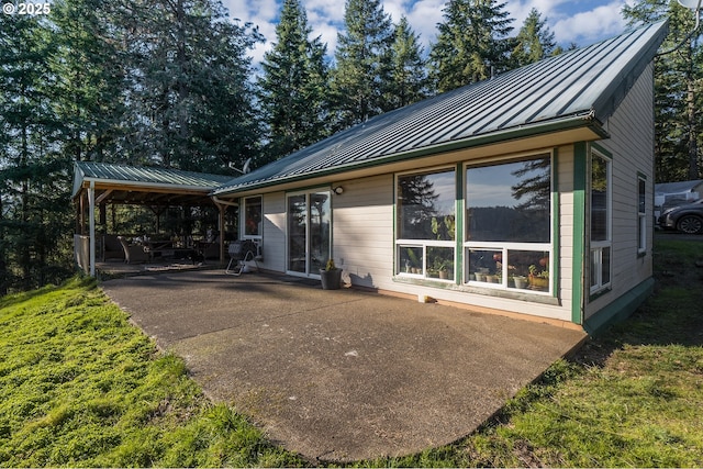 rear view of property featuring a patio