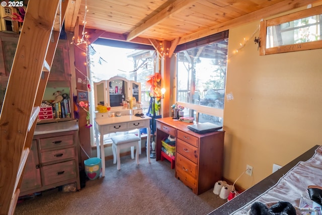 bedroom with beam ceiling, wood ceiling, and carpet floors