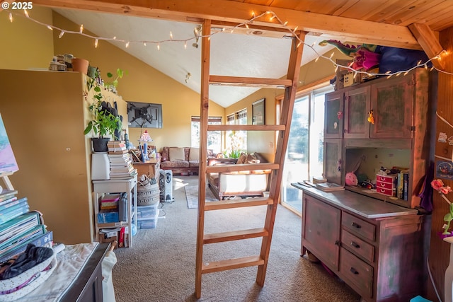 interior space featuring lofted ceiling with beams and light colored carpet