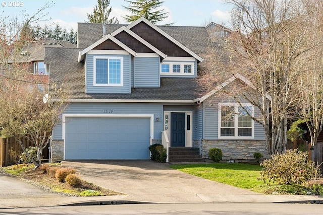 craftsman-style house with roof with shingles, concrete driveway, fence, a garage, and stone siding