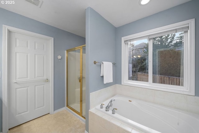 bathroom with a stall shower, visible vents, and a bath