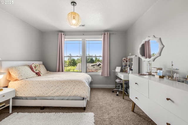 bedroom with carpet floors and baseboards