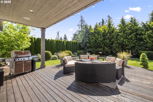 wooden terrace with grilling area and outdoor lounge area