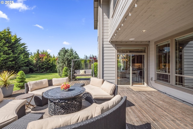 view of patio featuring an outdoor living space and a wooden deck