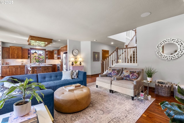 living room with wood finished floors, stairway, recessed lighting, and baseboards