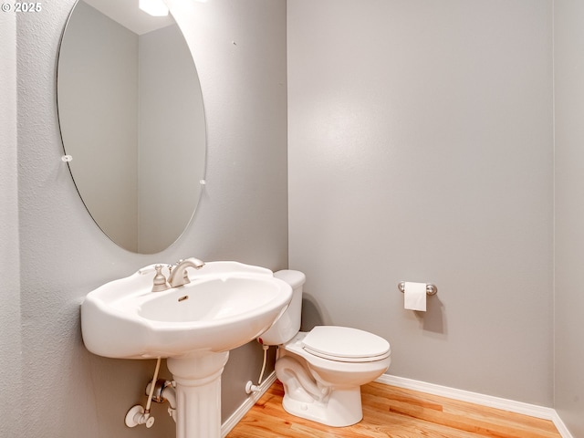 2104 NE 180th Pl, Vancouver, WA 98684 - half bathroom with wood finished floors, toilet, and baseboards