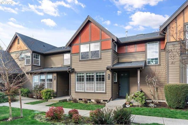 view of front of home featuring roof with shingles