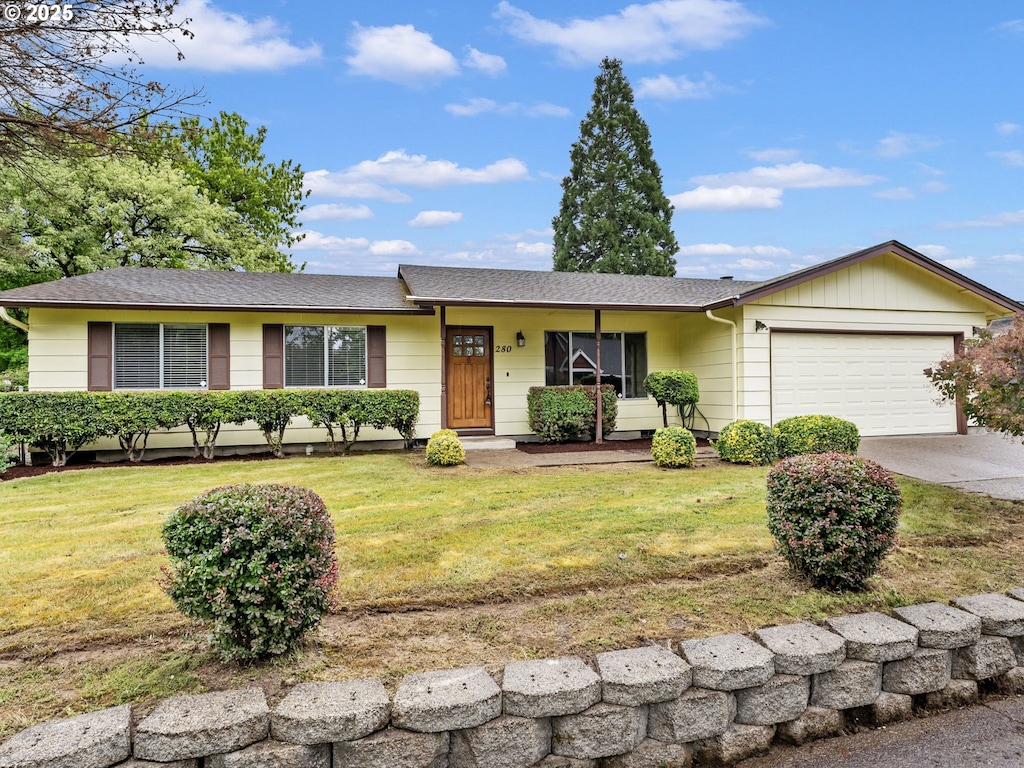 280 NE Dunn Pl, Mcminnville, OR 97128 - ranch-style home with an attached garage, a front lawn, driveway, and a shingled roof