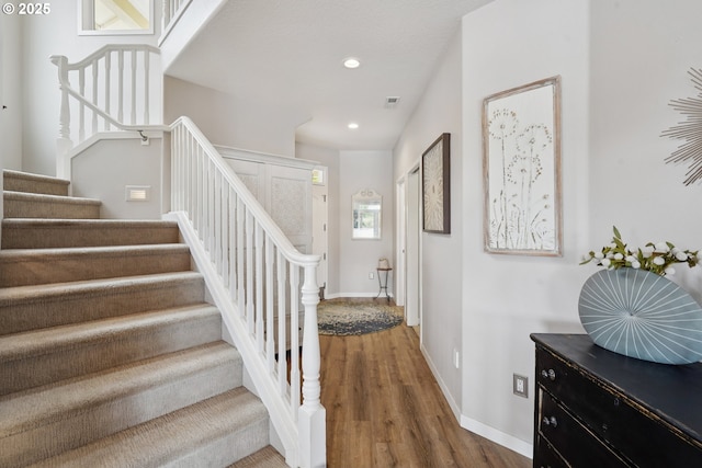 14587 NW Larson Rd Unit 4, Portland, OR 97231 - staircase featuring wood finished floors and recessed lighting