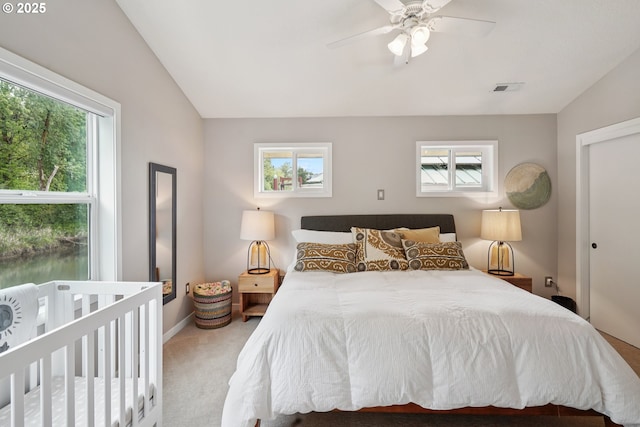 14587 NW Larson Rd Unit 4, Portland, OR 97231 - carpeted bedroom featuring vaulted ceiling and a ceiling fan