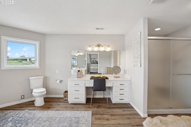 14587 NW Larson Rd Unit 4, Portland, OR 97231 - bathroom with wood finished floors, vanity, a stall shower, and a textured ceiling