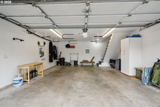 14587 NW Larson Rd Unit 4, Portland, OR 97231 - garage featuring a garage door opener and electric panel