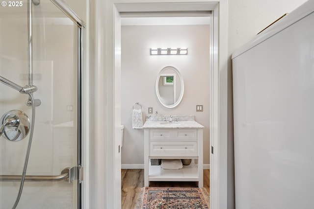 14587 NW Larson Rd Unit 4, Portland, OR 97231 - bathroom featuring wood finished floors, a shower stall, and vanity