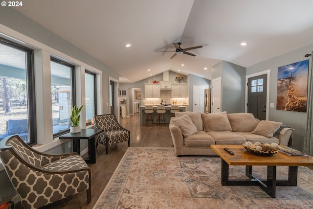 living area with lofted ceiling, a ceiling fan, wood finished floors, and recessed lighting