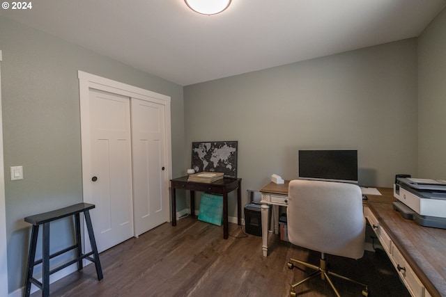 home office featuring baseboards and wood finished floors