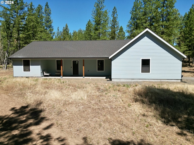 view of front of house with roof with shingles