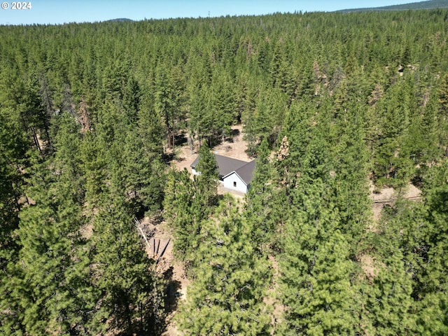 aerial view featuring a view of trees