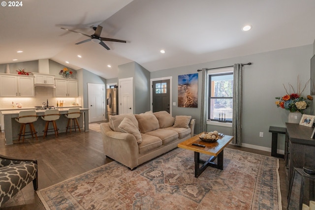 living room with lofted ceiling, ceiling fan, recessed lighting, baseboards, and dark wood-style floors