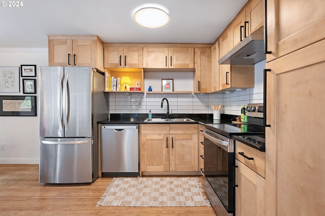 kitchen with sink, light brown cabinetry, stainless steel appliances, and exhaust hood