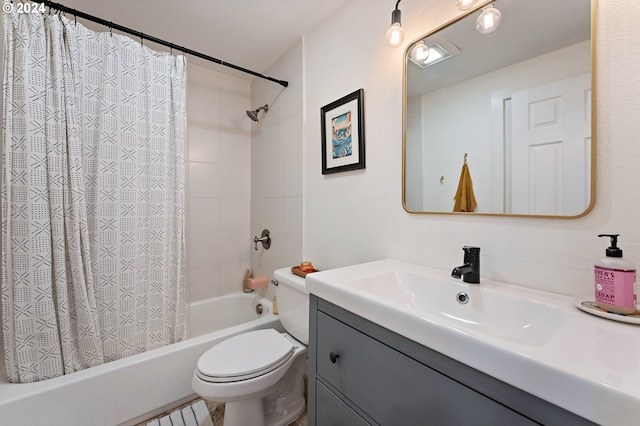 full bathroom featuring vanity, shower / tub combo, and toilet