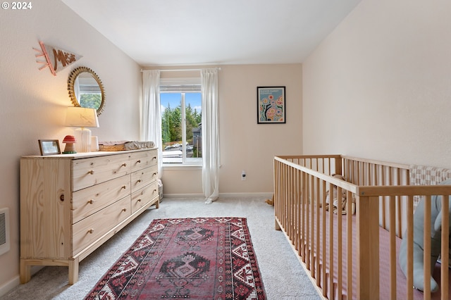 bedroom featuring light carpet