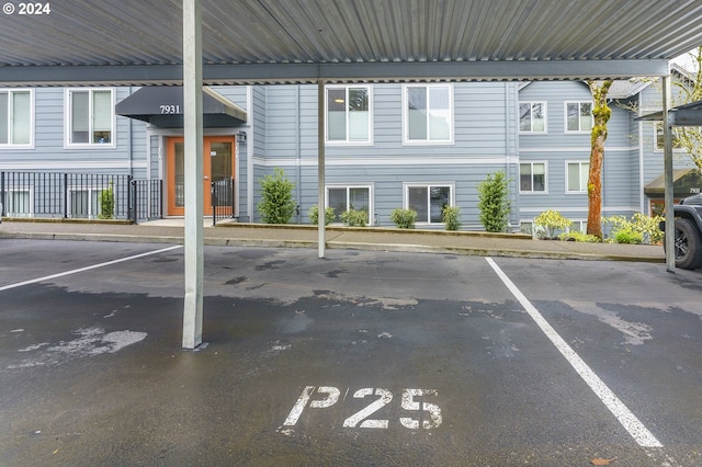 view of vehicle parking with a carport