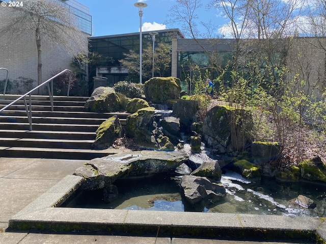 exterior space with a small pond