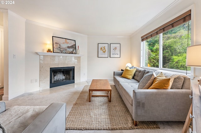 carpeted living room featuring crown molding and a fireplace