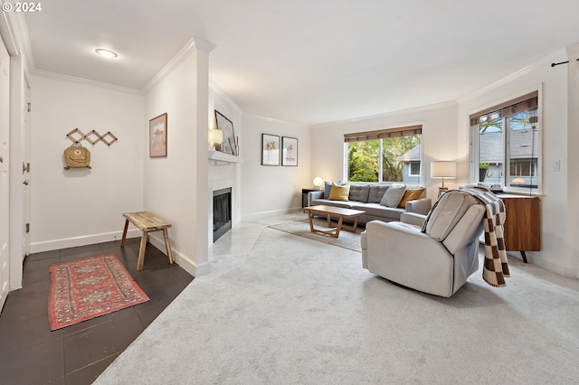 living room featuring a fireplace, carpet floors, and ornamental molding