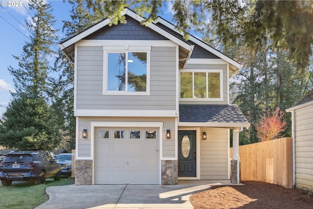 210 Mill St, Dayton, OR 97114 - view of front of house with a garage, concrete driveway, roof with shingles, and stone siding