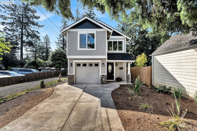 210 Mill St, Dayton, OR 97114 - view of front of property featuring a garage, driveway, stone siding, and roof with shingles