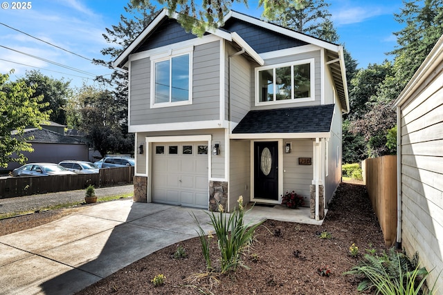 210 Mill St, Dayton, OR 97114 - view of front facade with a garage, concrete driveway, roof with shingles, and stone siding